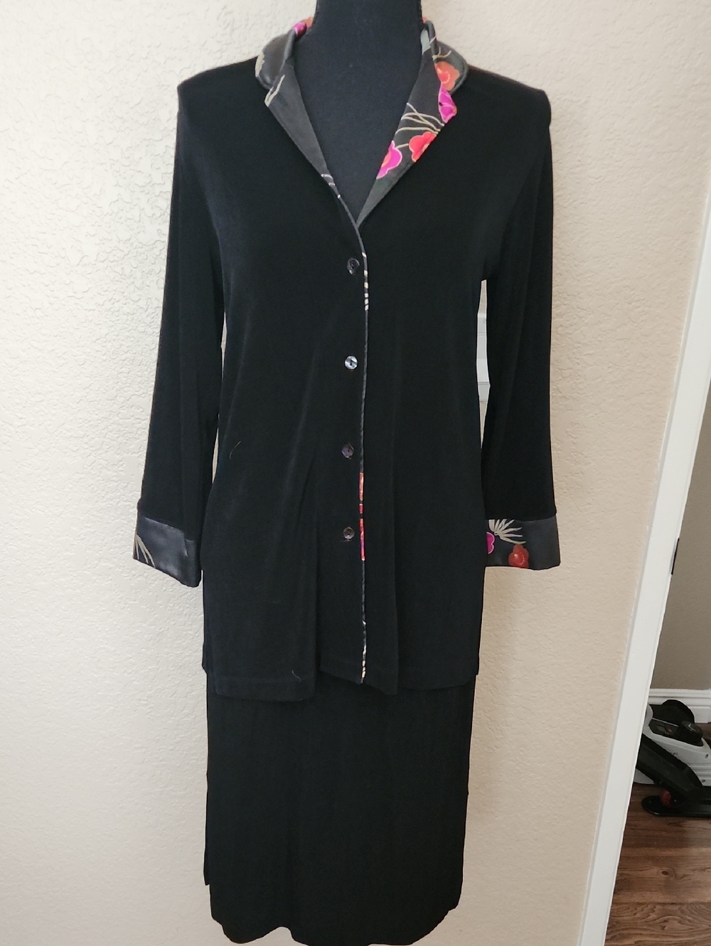 Chico's black Top with pink  and orange floral trim. Matching Black Skirt